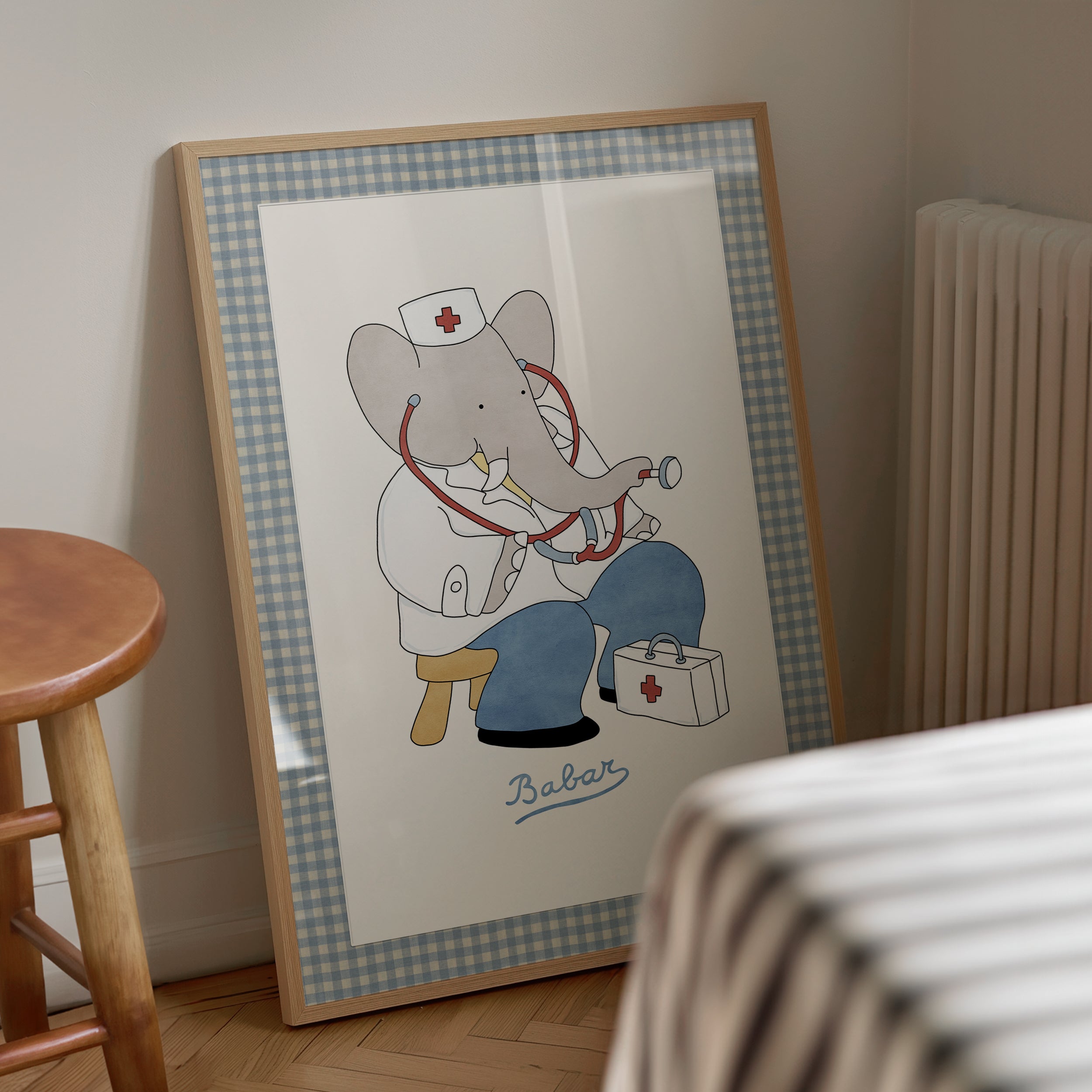 Framed Babar the Elephant as a doctor nursery wall art print with fabric-look border, vintage retro kids room decoration, literary storybook illustration