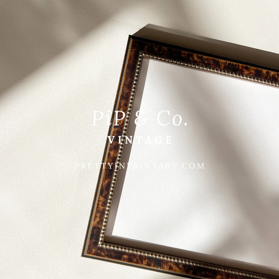 Close-up of the tortoiseshell-style wooden frame detail