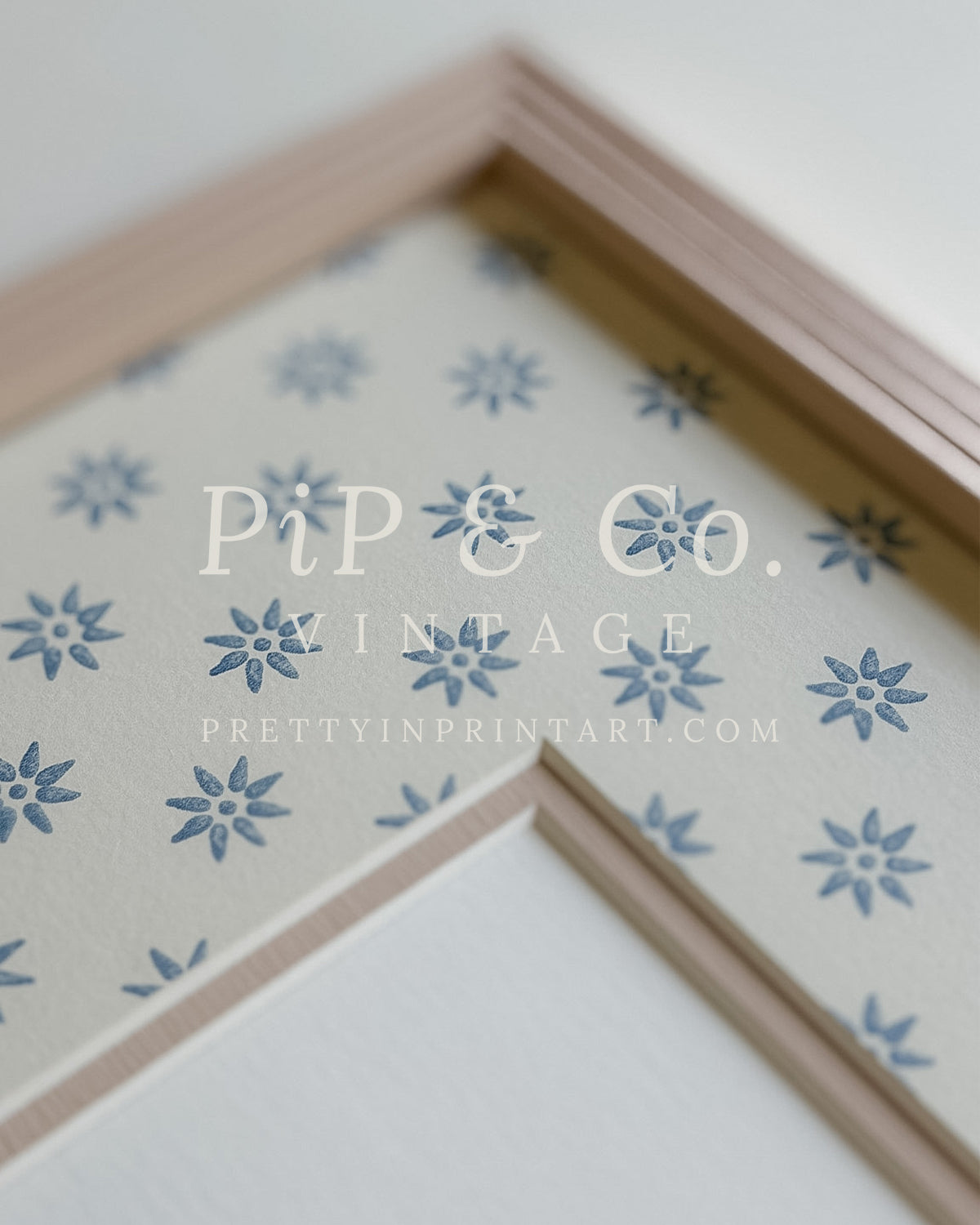 Hand painted reeded picture frame in Farrow and Ball Setting Plaster with Borastapeter Skogsstjarna wallpaper mount.