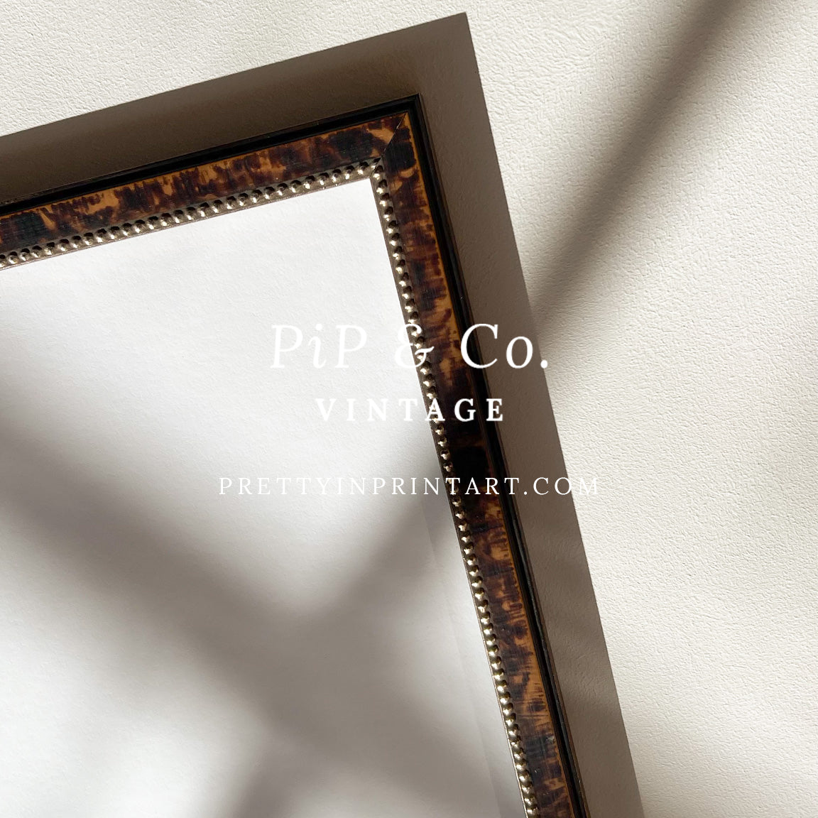 Tortoiseshell-style wooden frame styled in a room setting