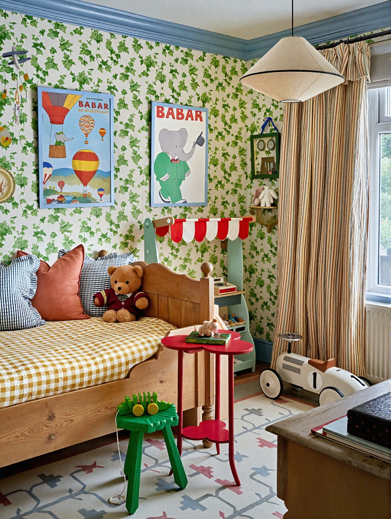 Vintage Babar the Elephant print framed on nursery wall.