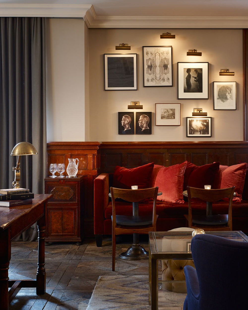 Vintage framed prints displayed on a pub wall, adding timeless character to the bar interior