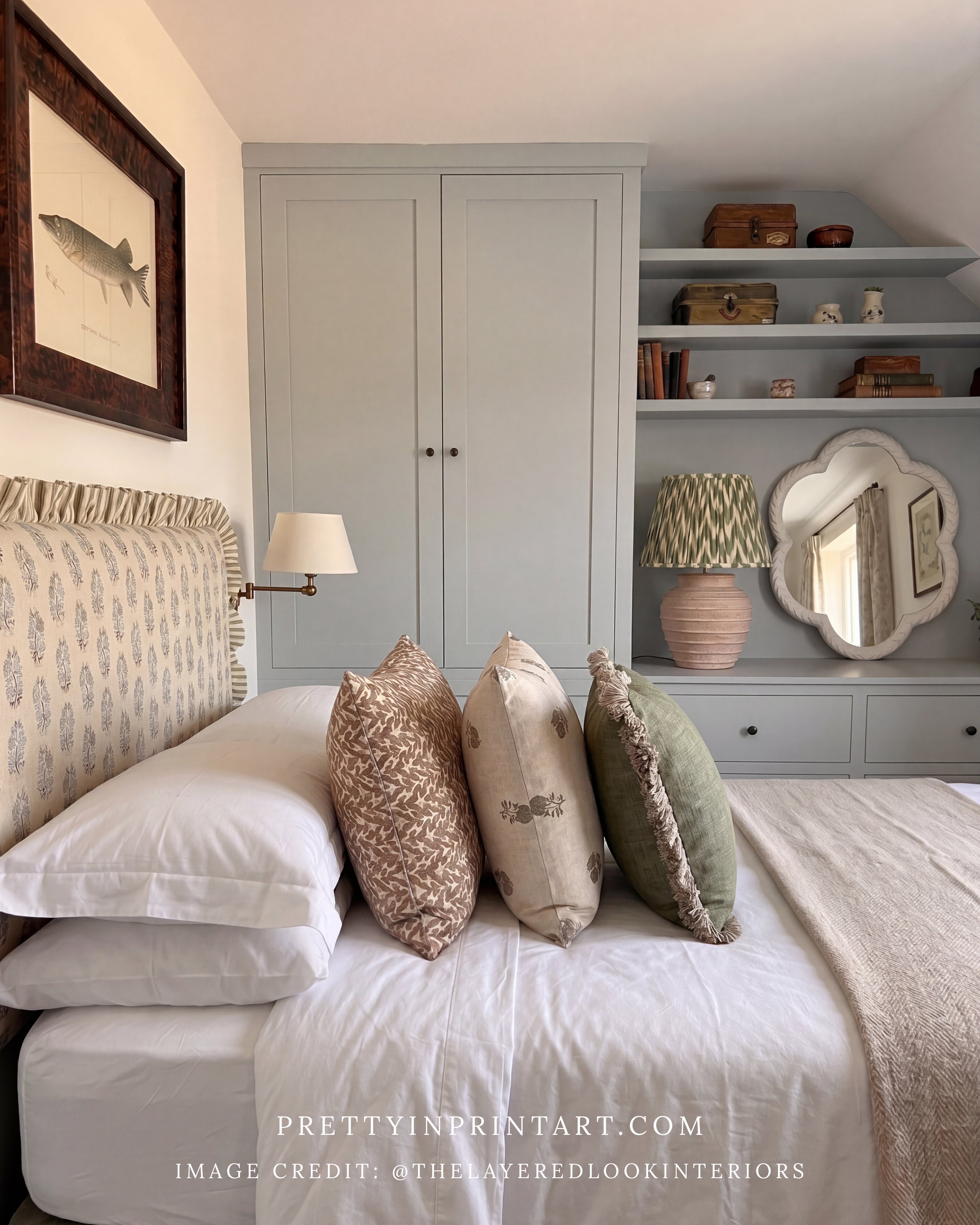 Neatly made bed with decorative pillows in a bedroom setting.