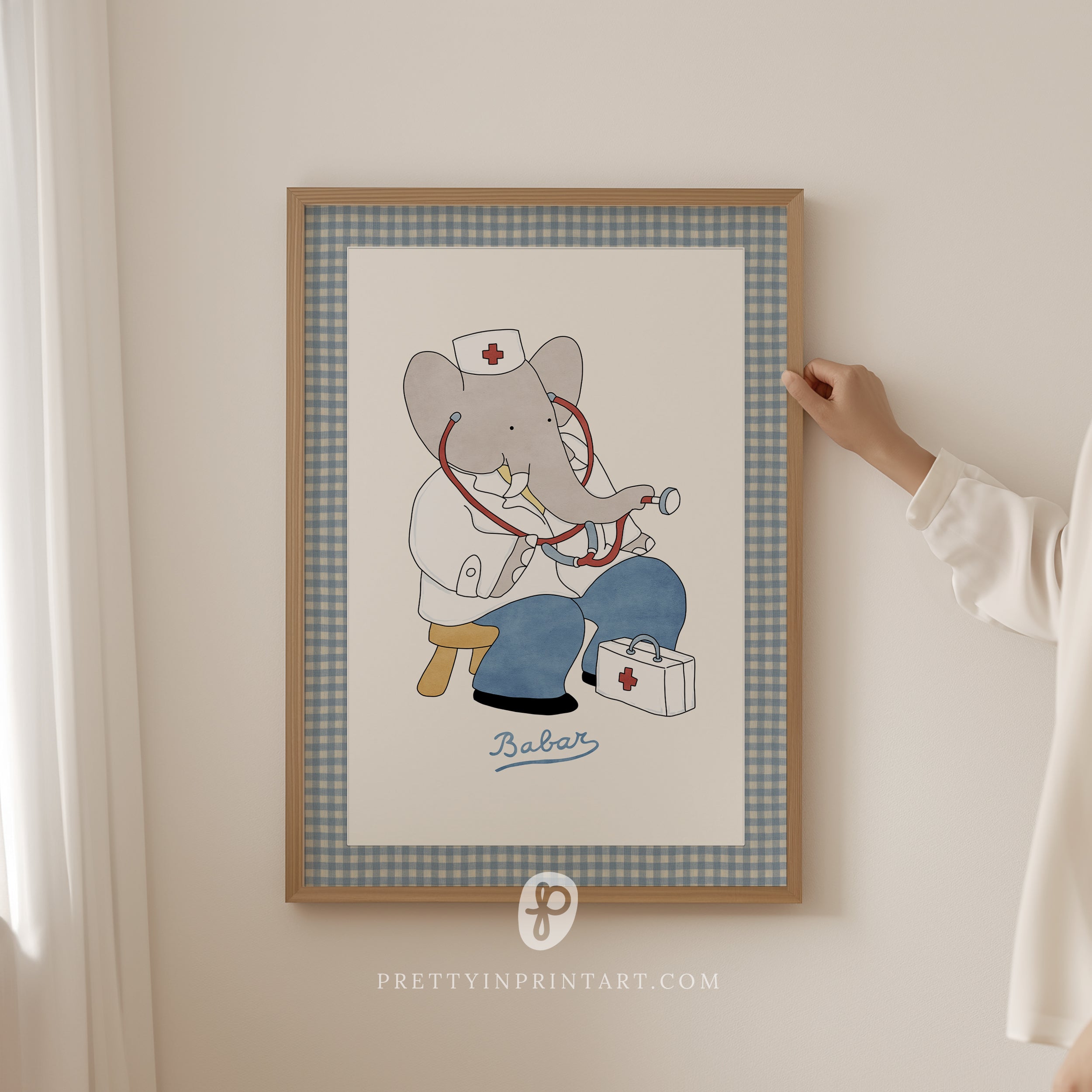 Framed Babar the Elephant as a doctor nursery wall art print with fabric-look border, vintage retro kids room decoration, literary storybook illustration