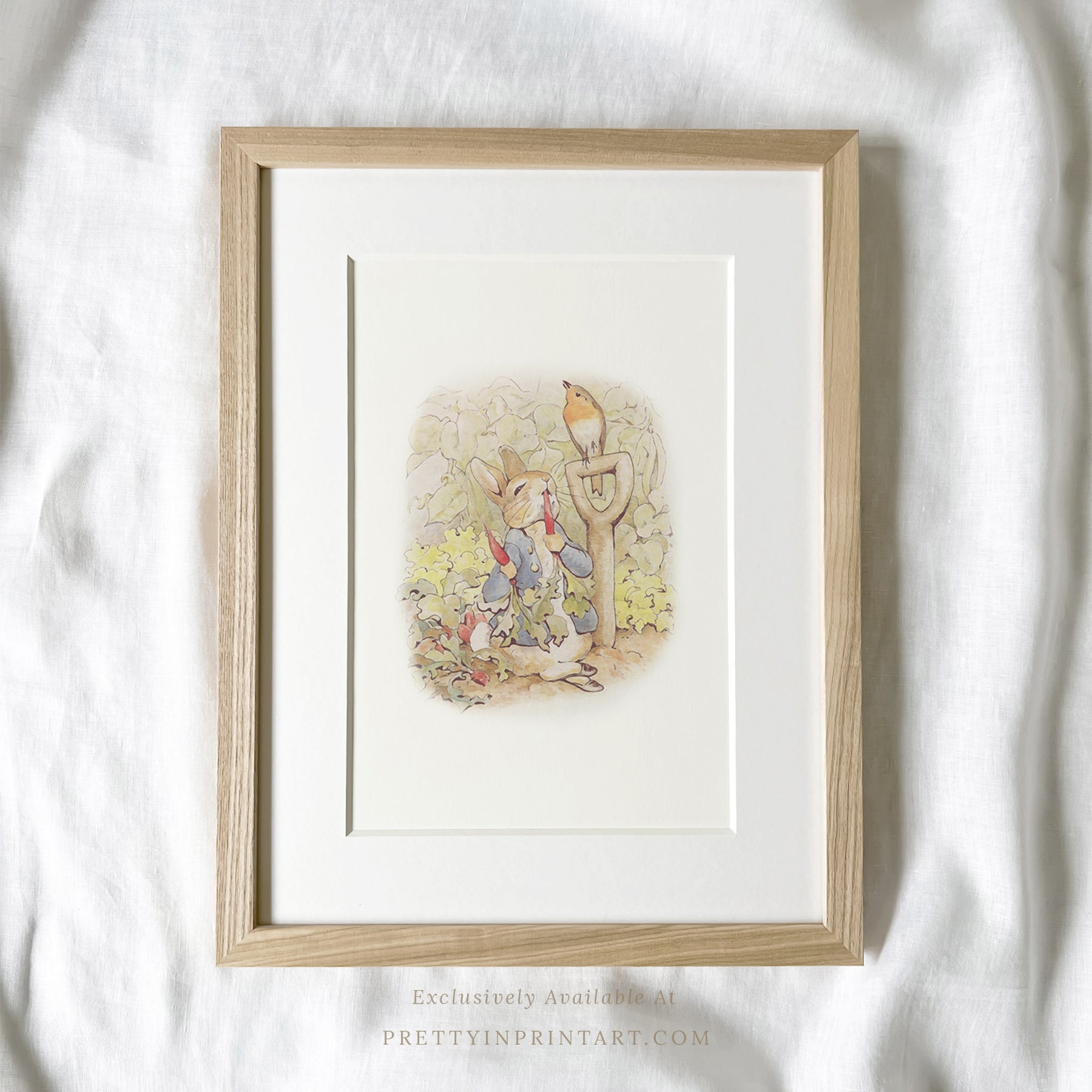 vintage Beatrix Potter nursery art print featuring Peter Rabbit in ornate gold picture frame, perfect for classic baby room decor