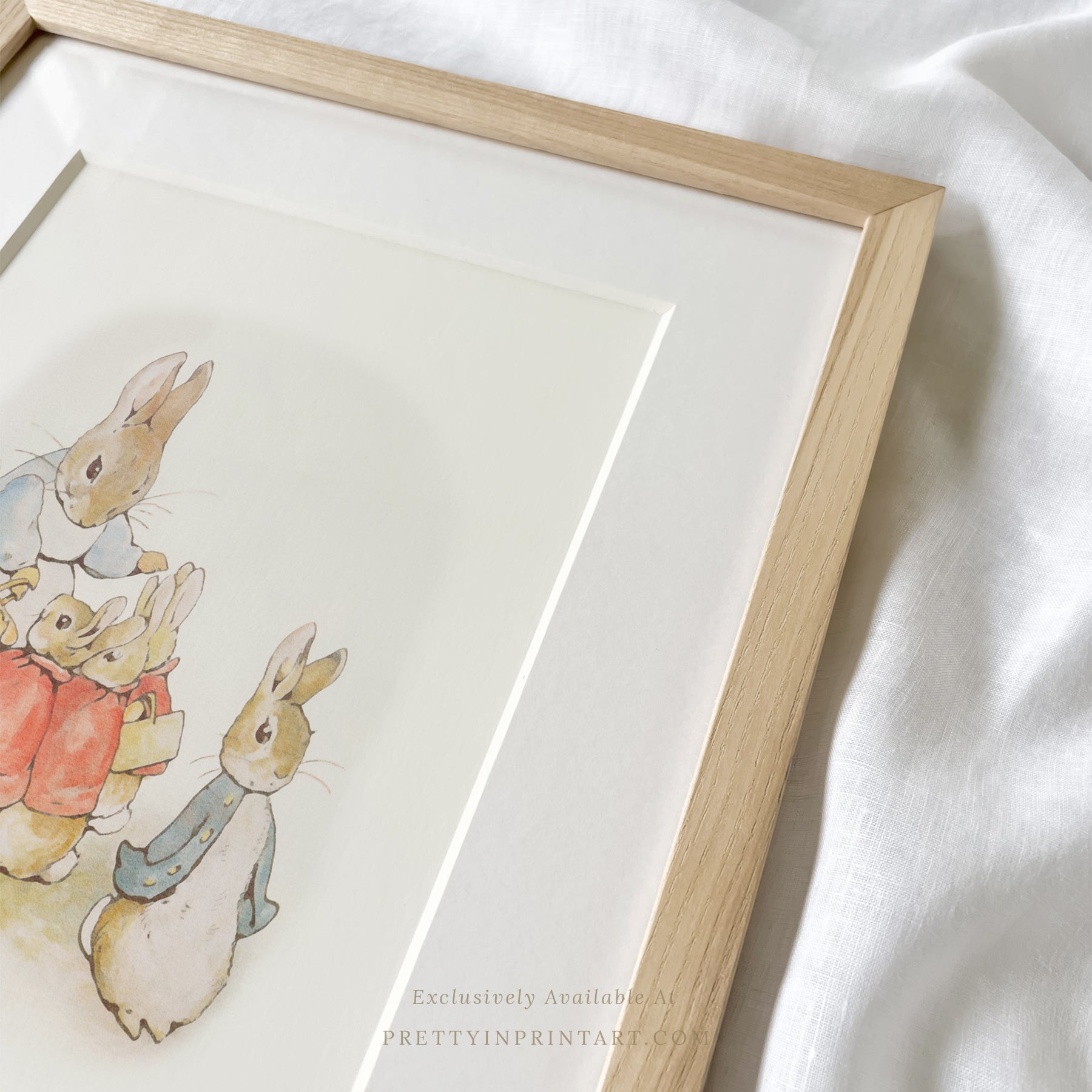 vintage Beatrix Potter nursery art print featuring Peter Rabbit in ornate gold picture frame, perfect for classic baby room decor