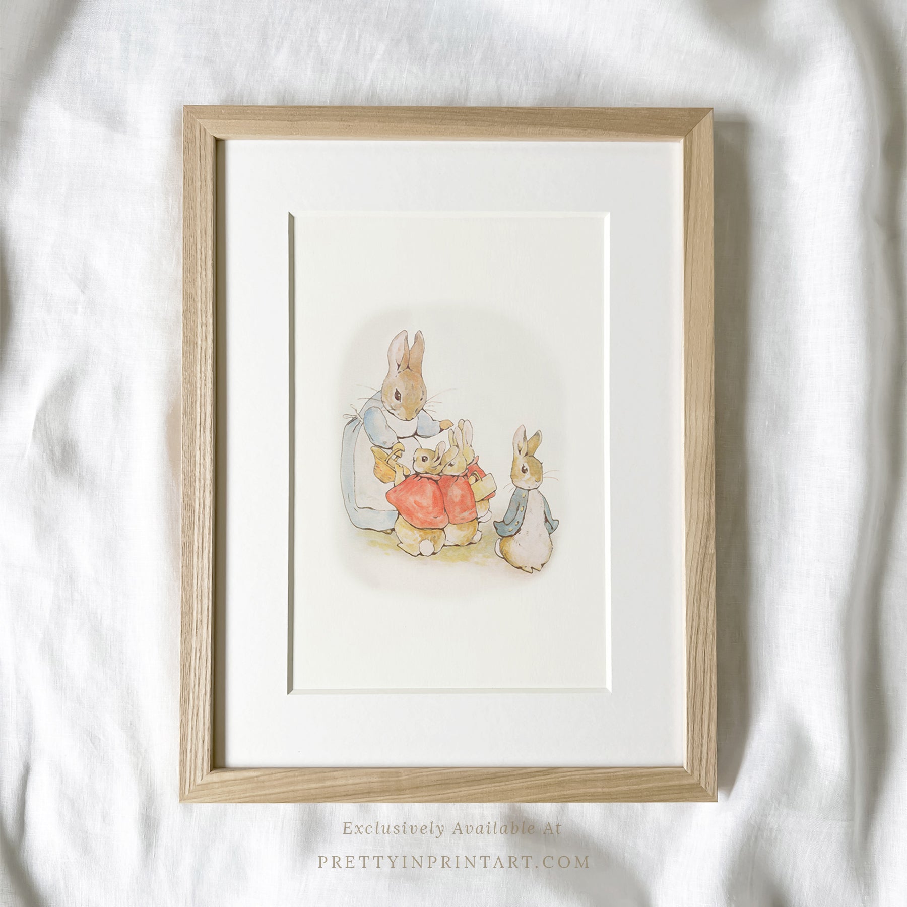 vintage Beatrix Potter nursery art print featuring Peter Rabbit in ornate gold picture frame, perfect for classic baby room decor