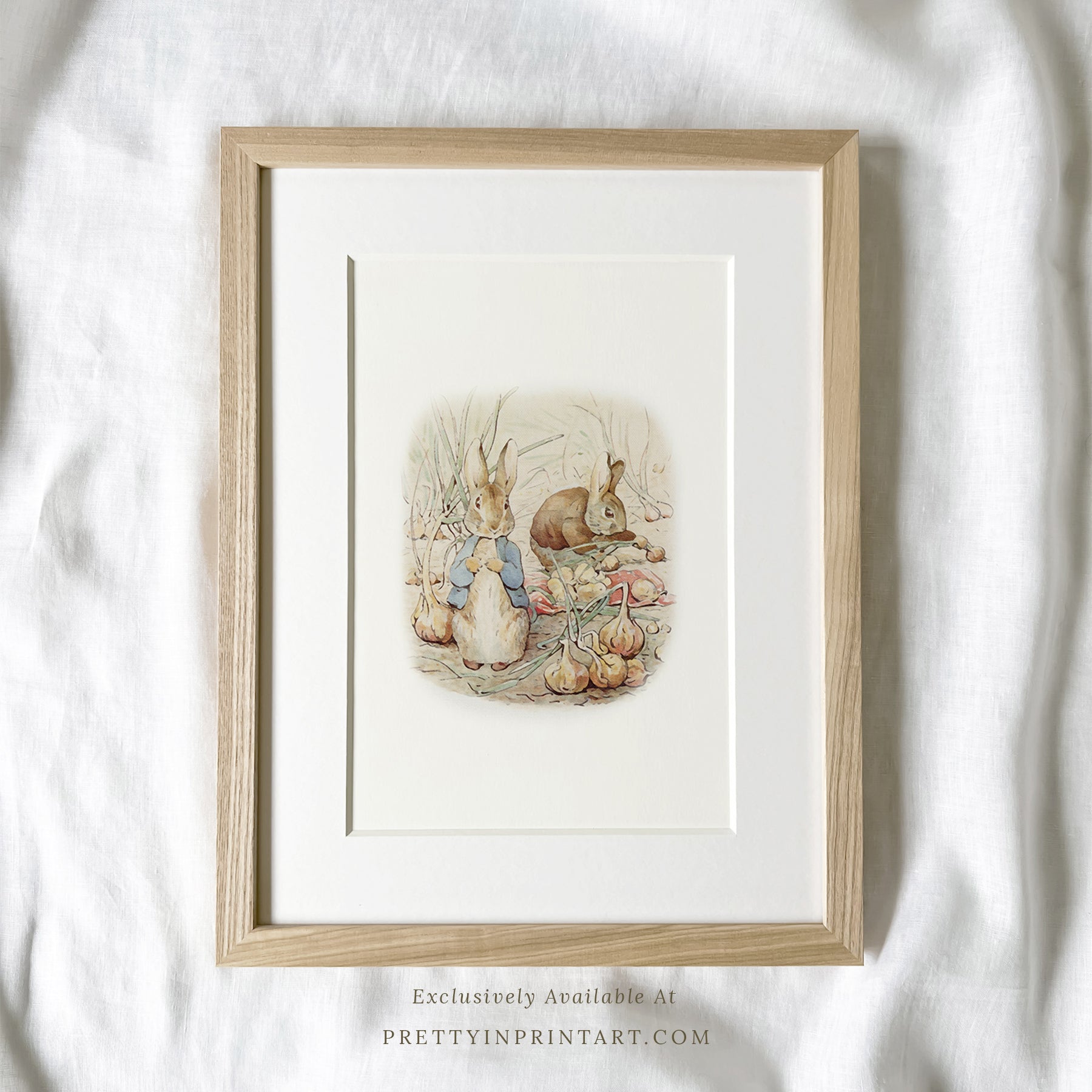 vintage Beatrix Potter nursery art print featuring Peter Rabbit in ornate gold picture frame, perfect for classic baby room decor
