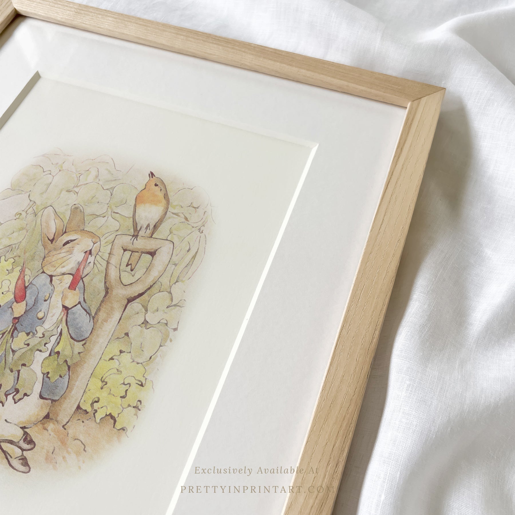 vintage Beatrix Potter nursery art print featuring Peter Rabbit in ornate gold picture frame, perfect for classic baby room decor