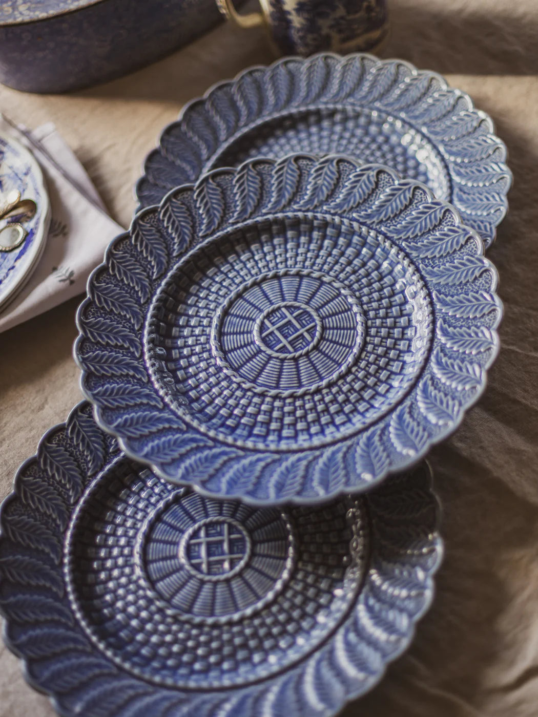 Bring timeless European charm to your wall or table with this beautiful set of three vintage Bordallo Pinheiro plates, crafted in Portugal.