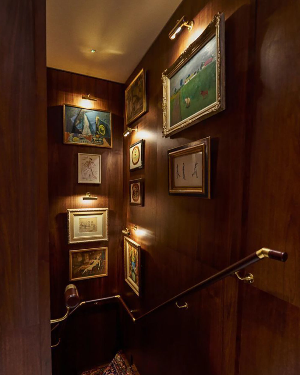Framed prints in a hotel corridor.