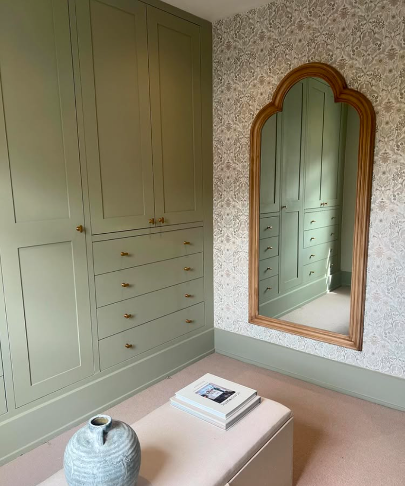 Sage green built in wardrobes.
