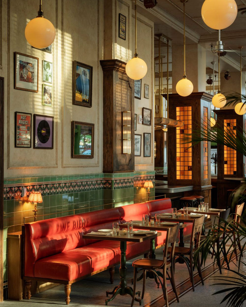 Pub interior with framed prints on the wall.