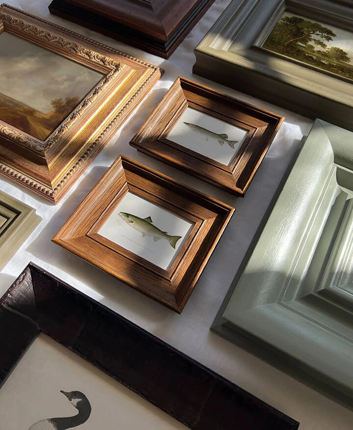 Antique art in ornate vintage frames for traditional interior design